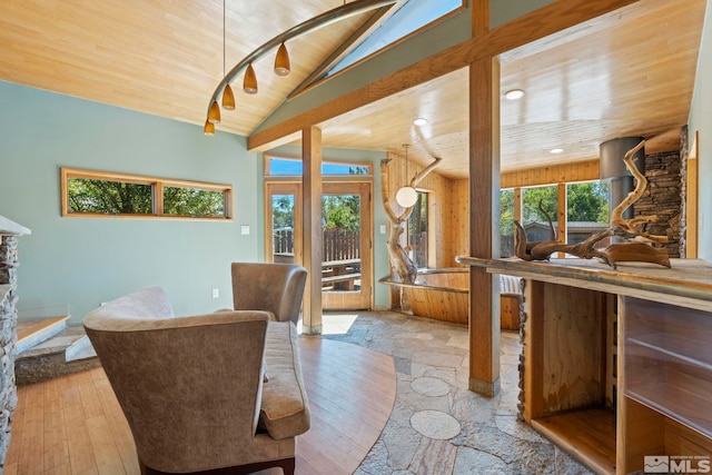 sitting room with high vaulted ceiling, light wood-type flooring, and wood ceiling