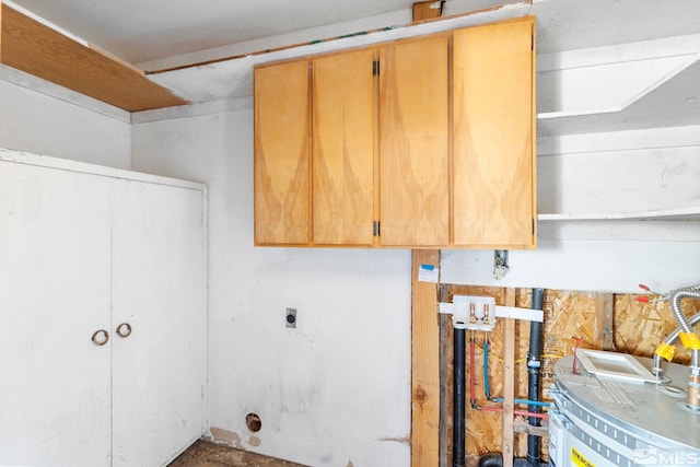 washroom featuring cabinet space and electric dryer hookup