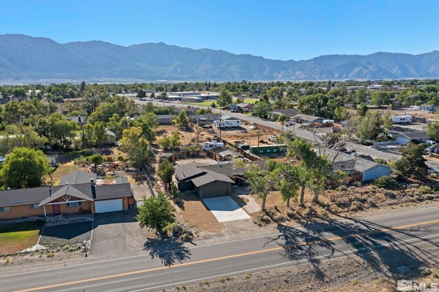 birds eye view of property featuring a mountain view