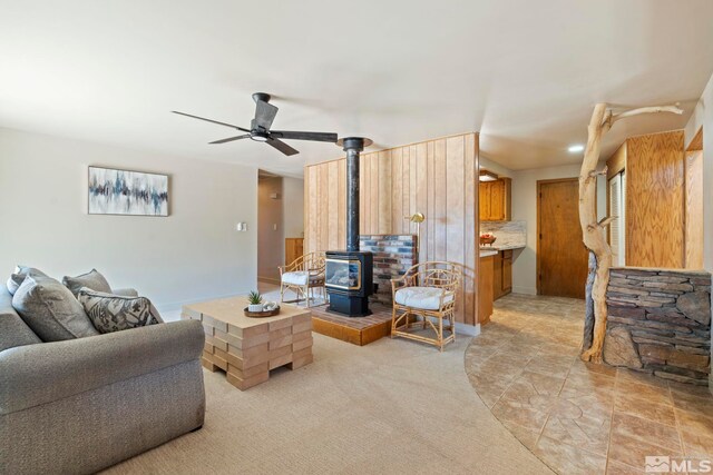 kitchen featuring decorative backsplash, light tile patterned floors, sink, kitchen peninsula, and stainless steel appliances