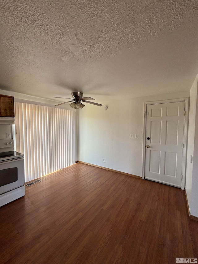 unfurnished living room with a textured ceiling, ceiling fan, and hardwood / wood-style floors