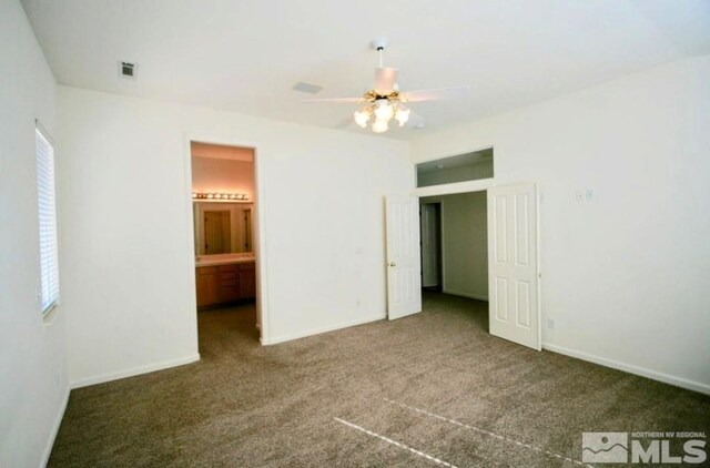 unfurnished room featuring ceiling fan and carpet