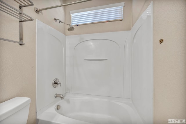 bathroom with toilet and shower / bathtub combination