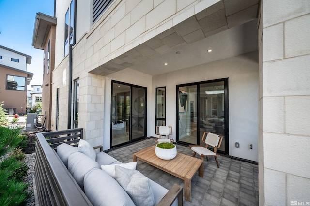 view of patio / terrace with cooling unit and an outdoor hangout area