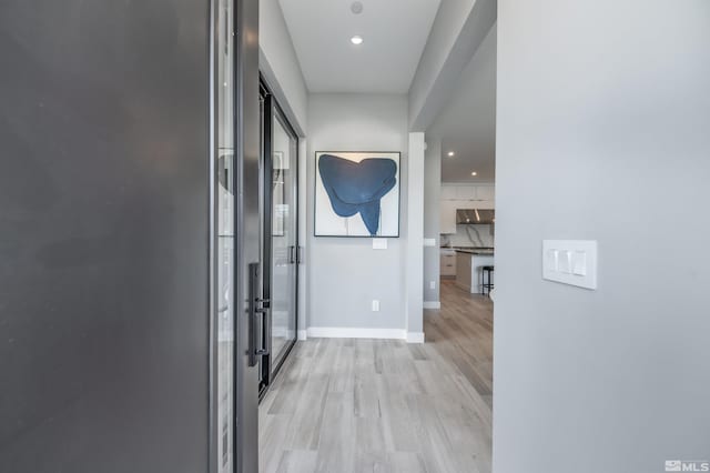 hallway featuring light hardwood / wood-style floors