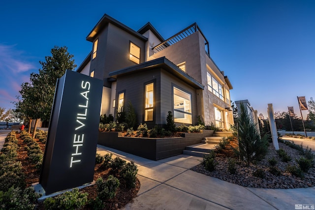 view of property exterior at dusk