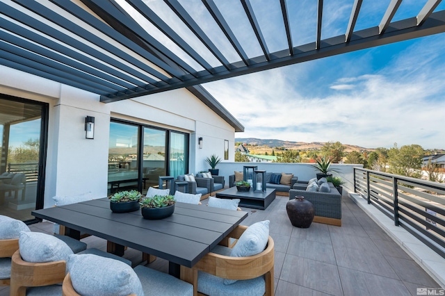 view of patio / terrace with outdoor lounge area and a mountain view