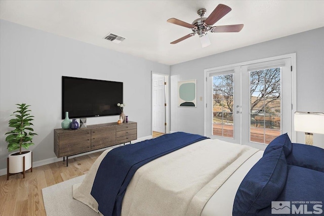 bedroom featuring visible vents, baseboards, light wood-style floors, access to exterior, and french doors