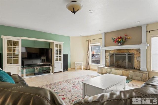 living room featuring a fireplace