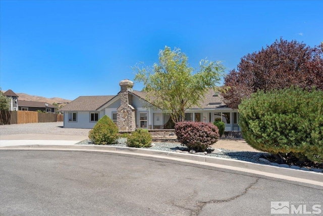 view of front of house featuring fence