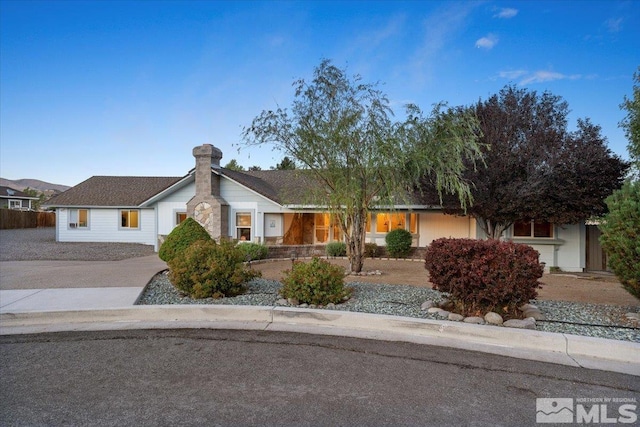 single story home featuring driveway