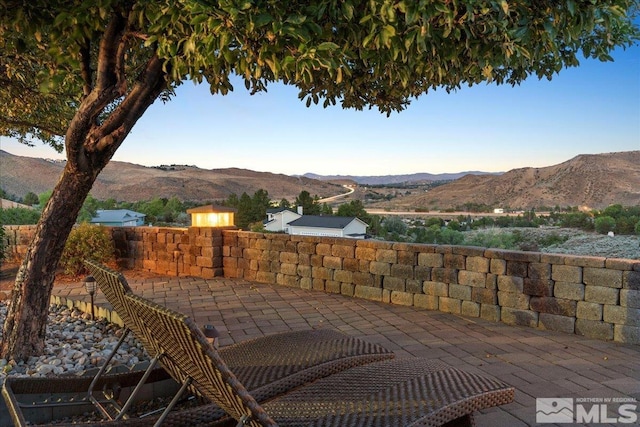 view of patio / terrace with a mountain view