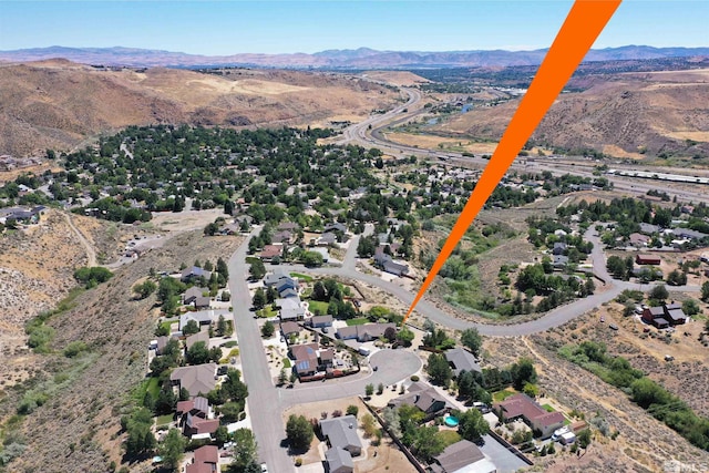 birds eye view of property with a residential view and a mountain view