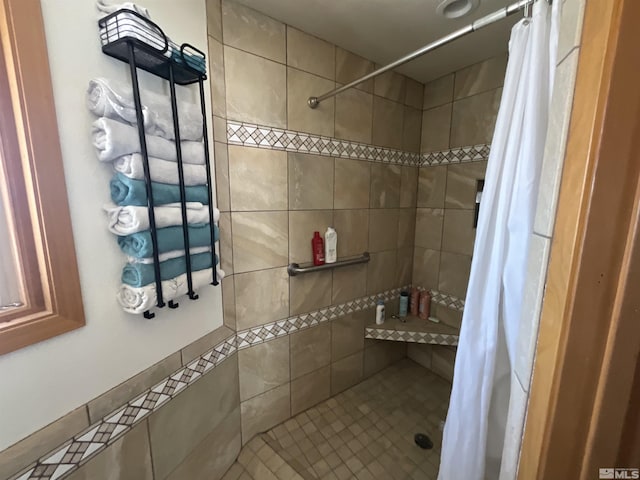 full bath with tiled shower