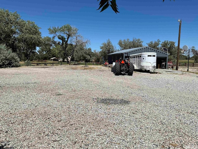 view of yard with an outbuilding and a garage