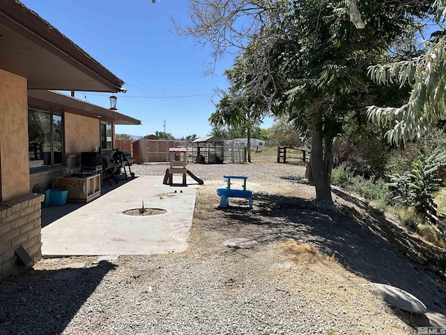 view of yard with a patio area and fence