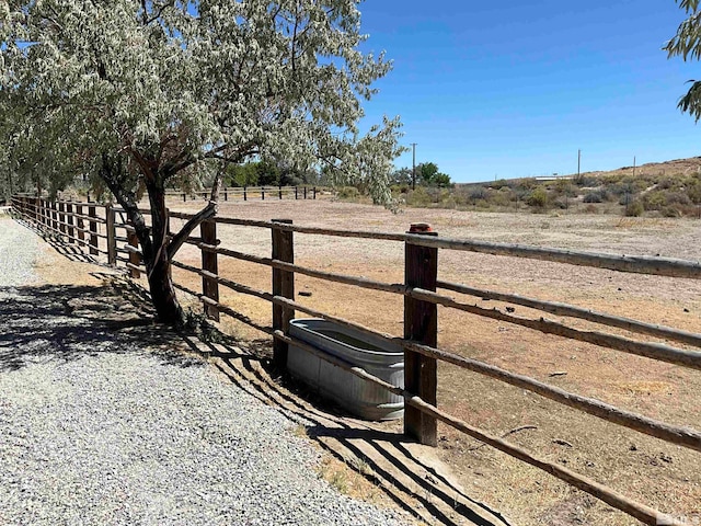 view of gate featuring a rural view