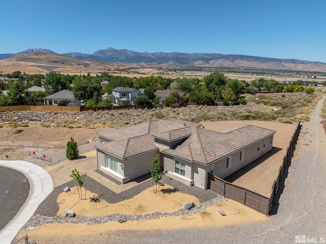 birds eye view of property featuring a mountain view