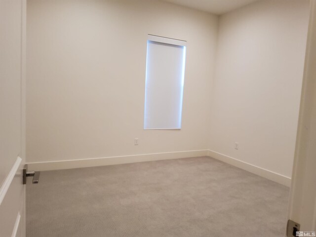 spare room with light carpet