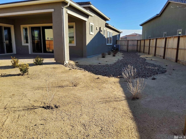 back of property featuring a patio area