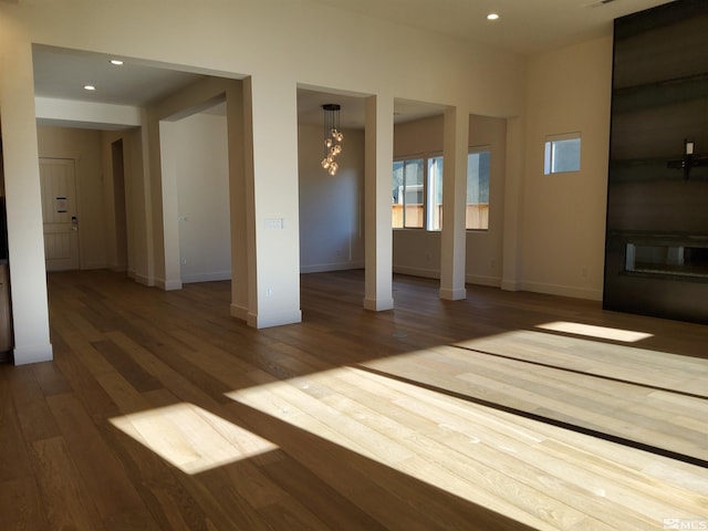 unfurnished room with hardwood / wood-style flooring