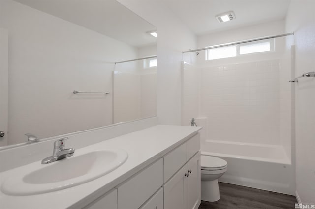 full bathroom featuring shower / tub combination, toilet, vanity, and hardwood / wood-style flooring