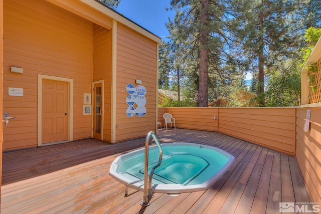 view of swimming pool with a wooden deck