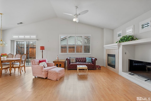 living room with light wood-style flooring and a wealth of natural light