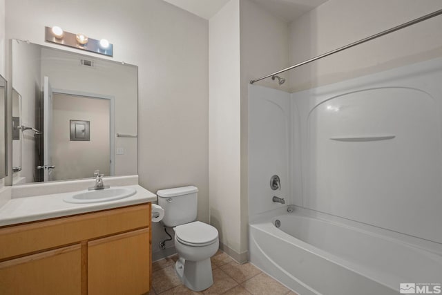 full bathroom featuring toilet, washtub / shower combination, tile patterned flooring, and vanity