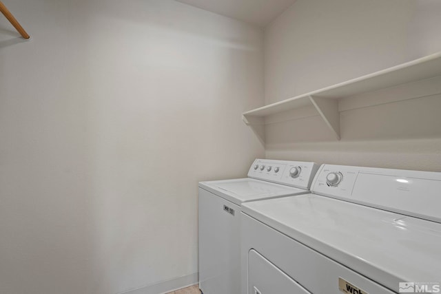 laundry room with washer and clothes dryer