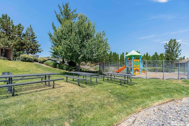 surrounding community featuring a yard and a playground