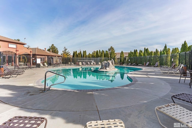 view of swimming pool with a patio