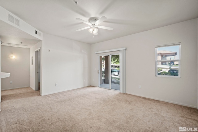 carpeted empty room with ceiling fan