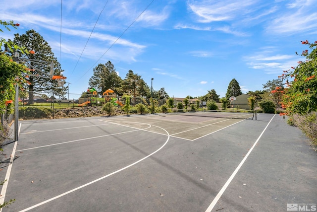 view of sport court featuring community basketball court, a tennis court, and fence