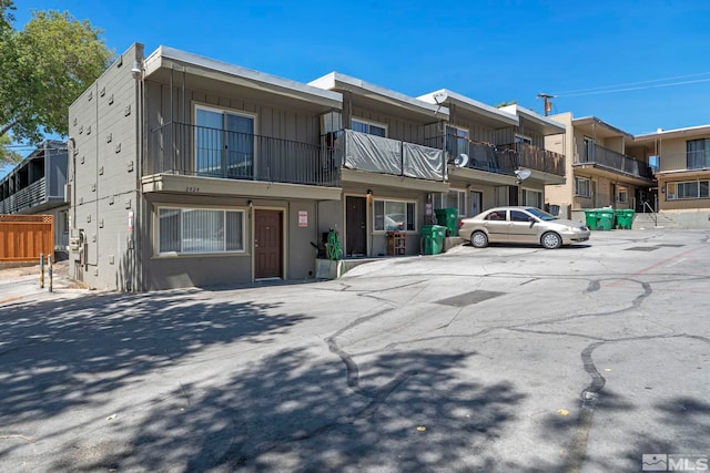 view of front of home featuring a balcony