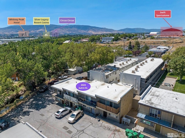 birds eye view of property with a mountain view