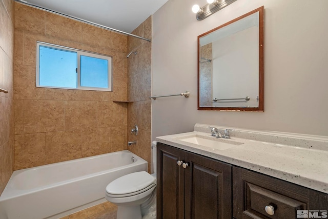 bathroom with vanity, shower / tub combination, and toilet