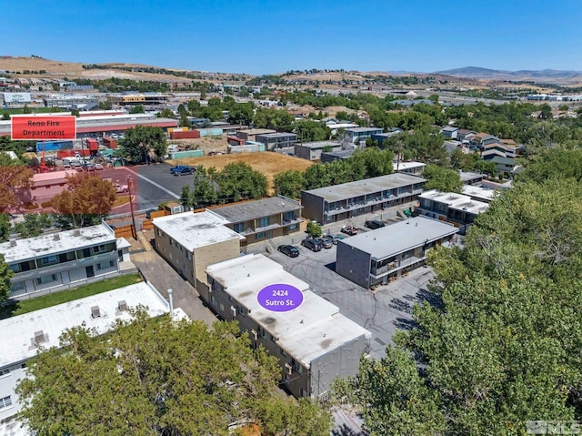 birds eye view of property featuring a mountain view