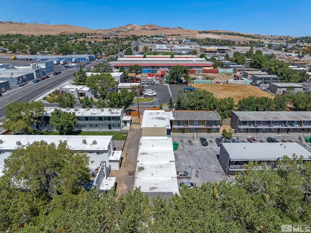 drone / aerial view with a residential view and a mountain view