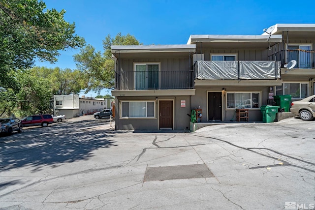 multi unit property featuring board and batten siding and a balcony