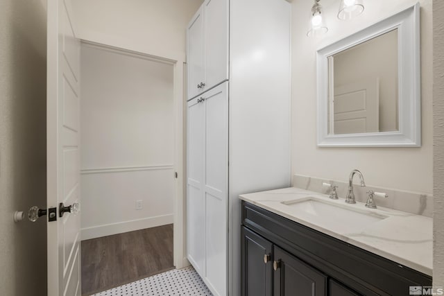 bathroom featuring tile patterned flooring and vanity