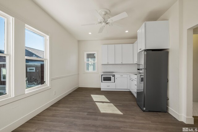 kitchen with ceiling fan, plenty of natural light, dark hardwood / wood-style floors, and fridge