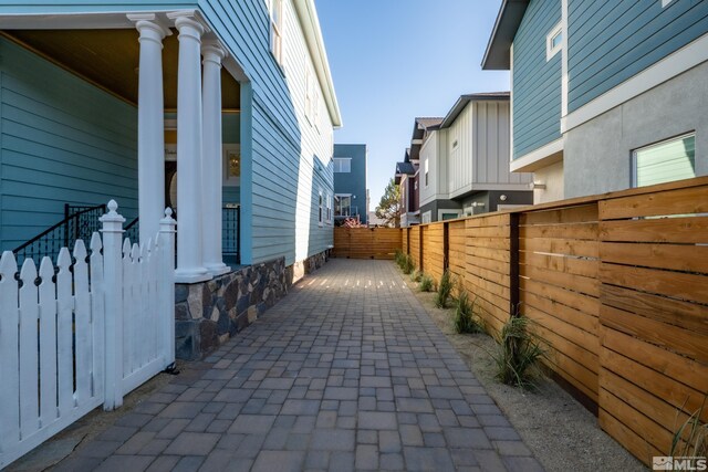 view of side of home with a patio