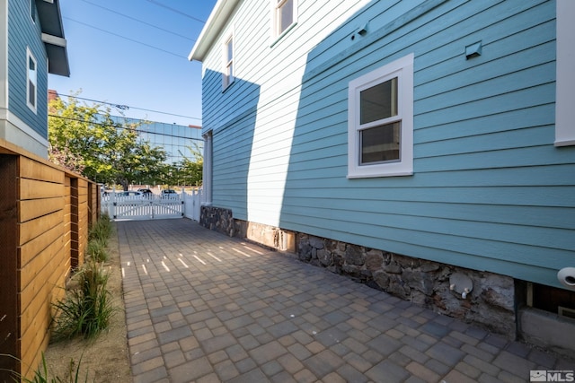 view of patio / terrace featuring a gate and fence