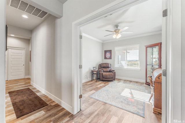 interior space with baseboards, visible vents, wood finished floors, crown molding, and recessed lighting