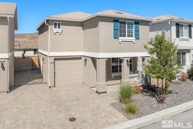 back of property featuring a garage