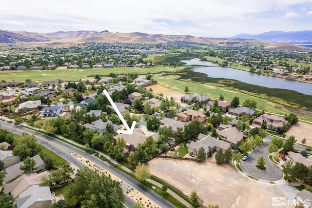 aerial view with a residential view and a water and mountain view