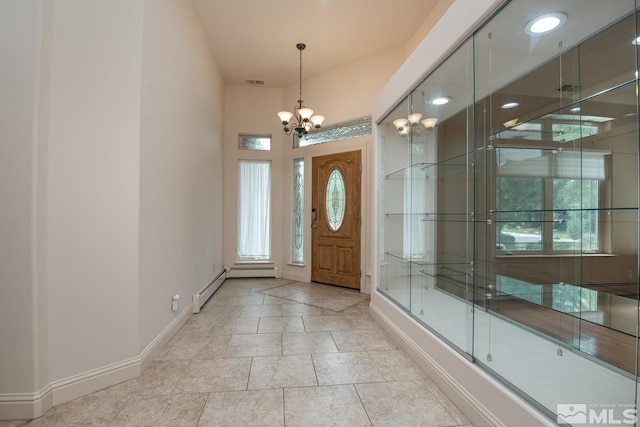 foyer featuring a baseboard radiator, visible vents, baseboards, and an inviting chandelier