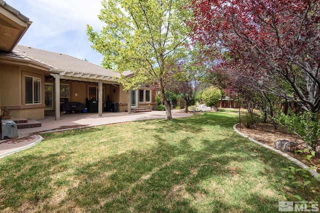 view of yard featuring a patio area and fence