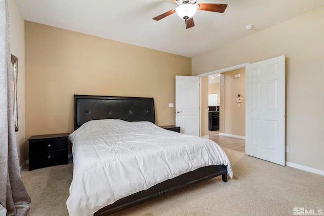 carpeted bedroom featuring a ceiling fan and baseboards